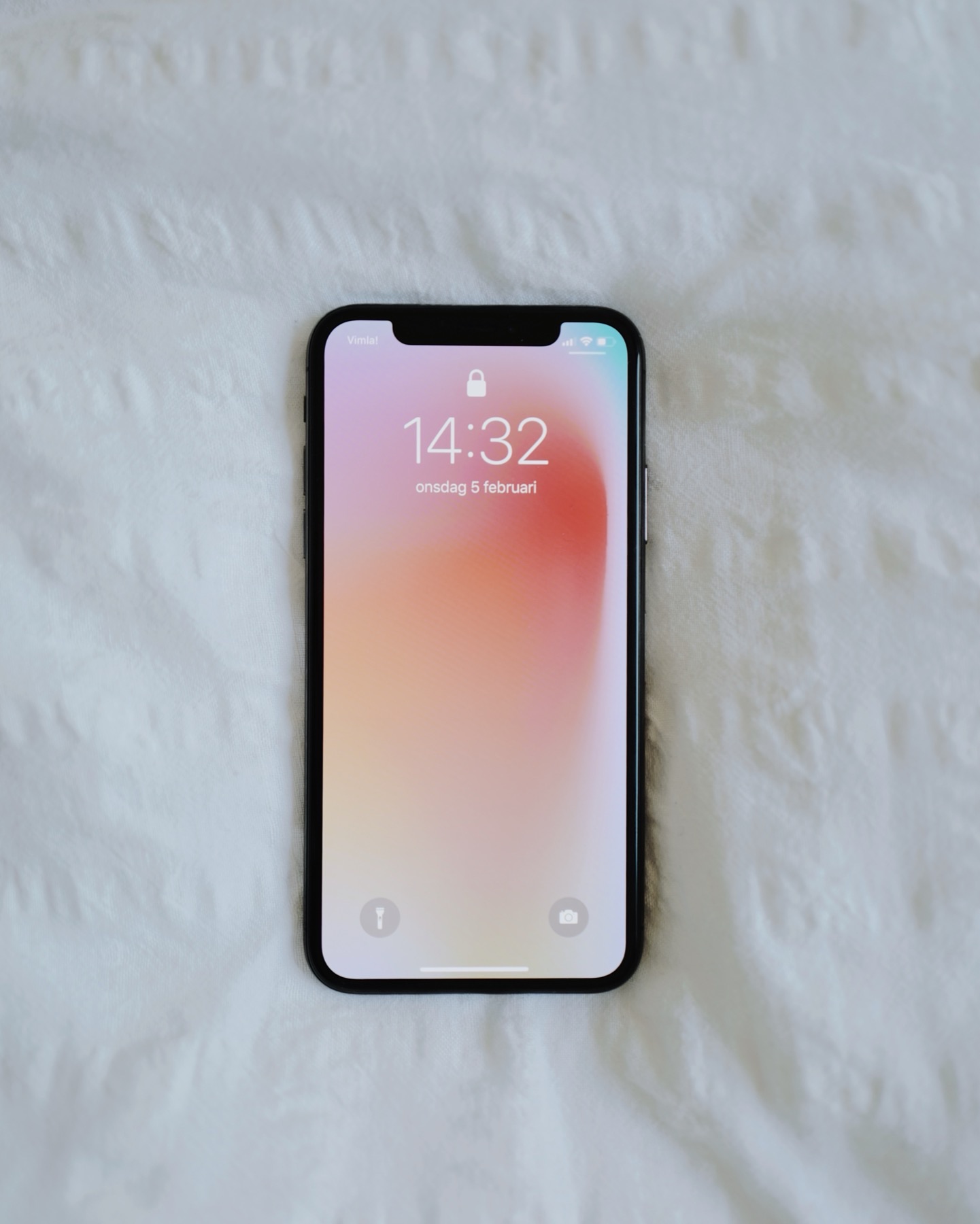 Smartphone on white fabric