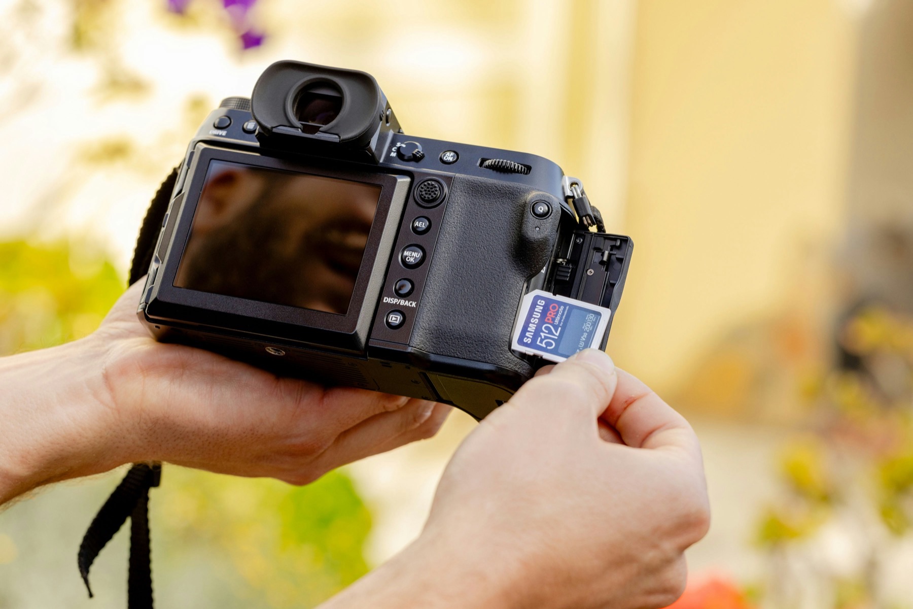 Hands holding a digital camera