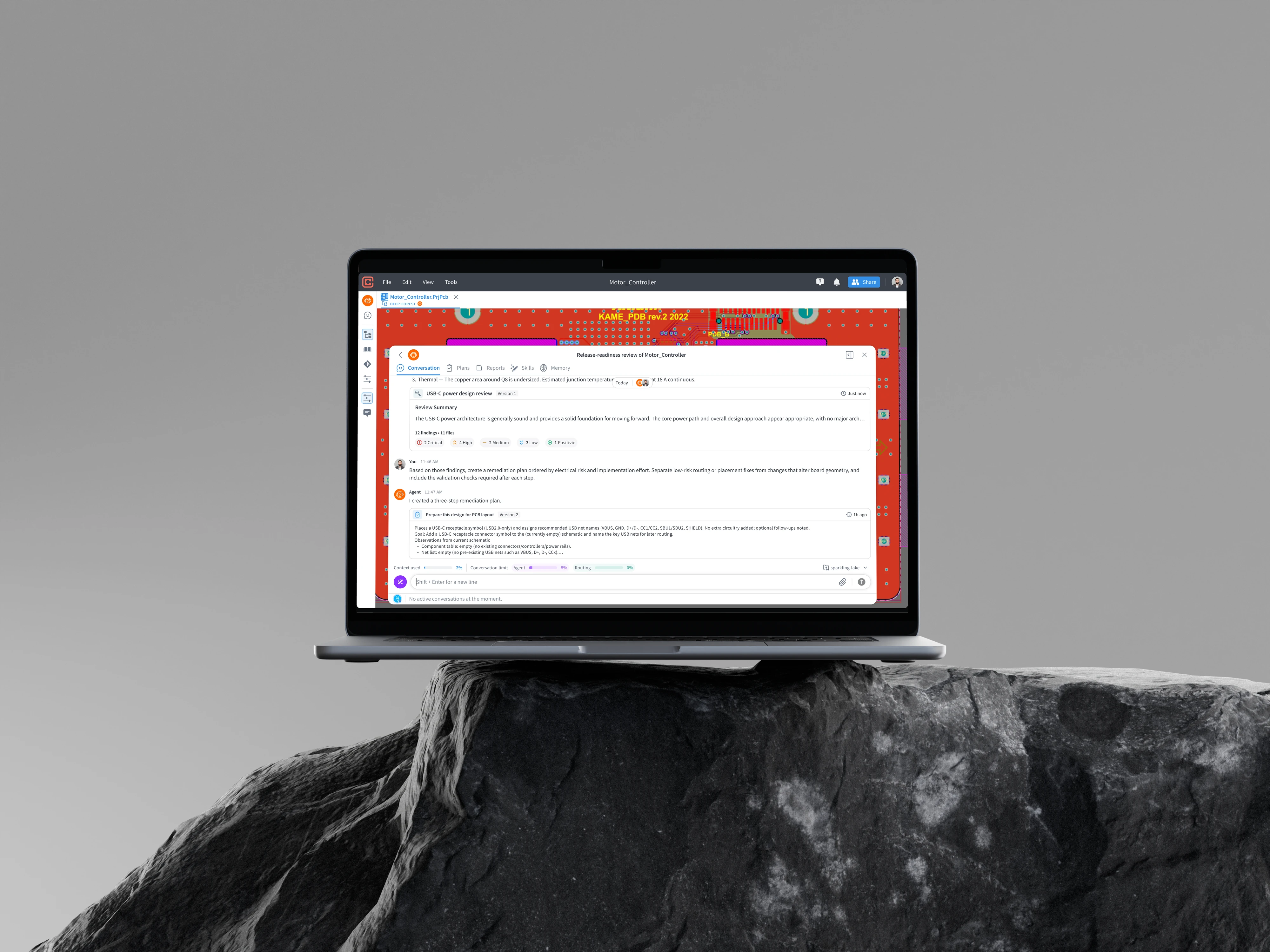 Laptop showing the Circuitly agent chat on a rock