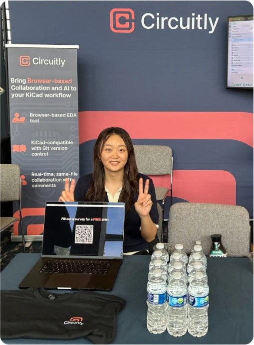 Circuitly booth at PCB West with a team member at the demo table